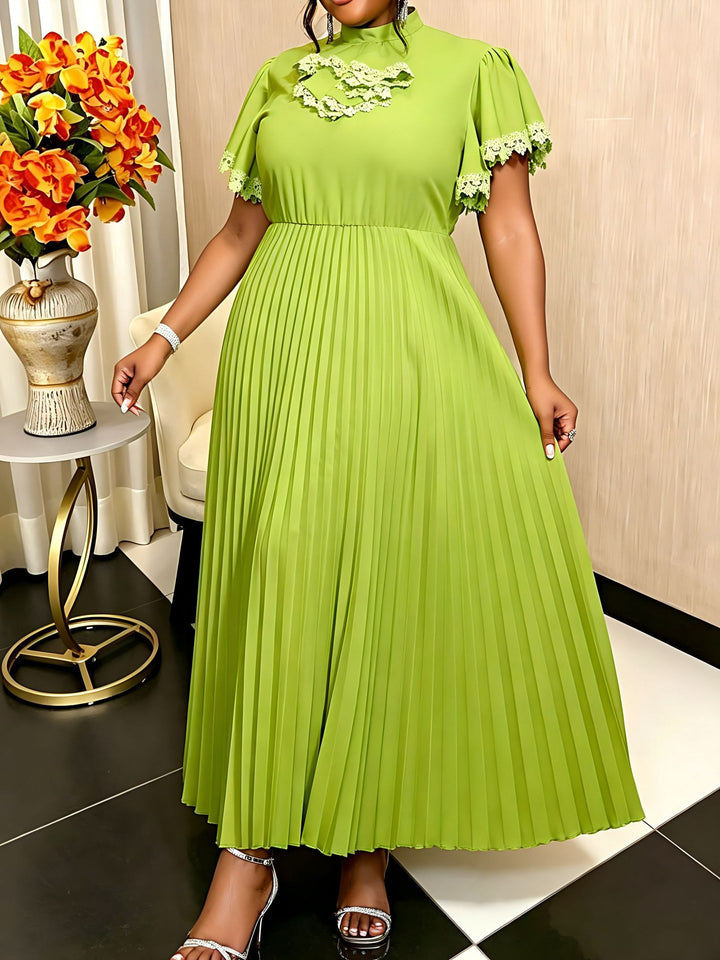 Damer Elegant Maxi-klänning med plisséveck och volangdetaljer Mirla-Eva Jonsson