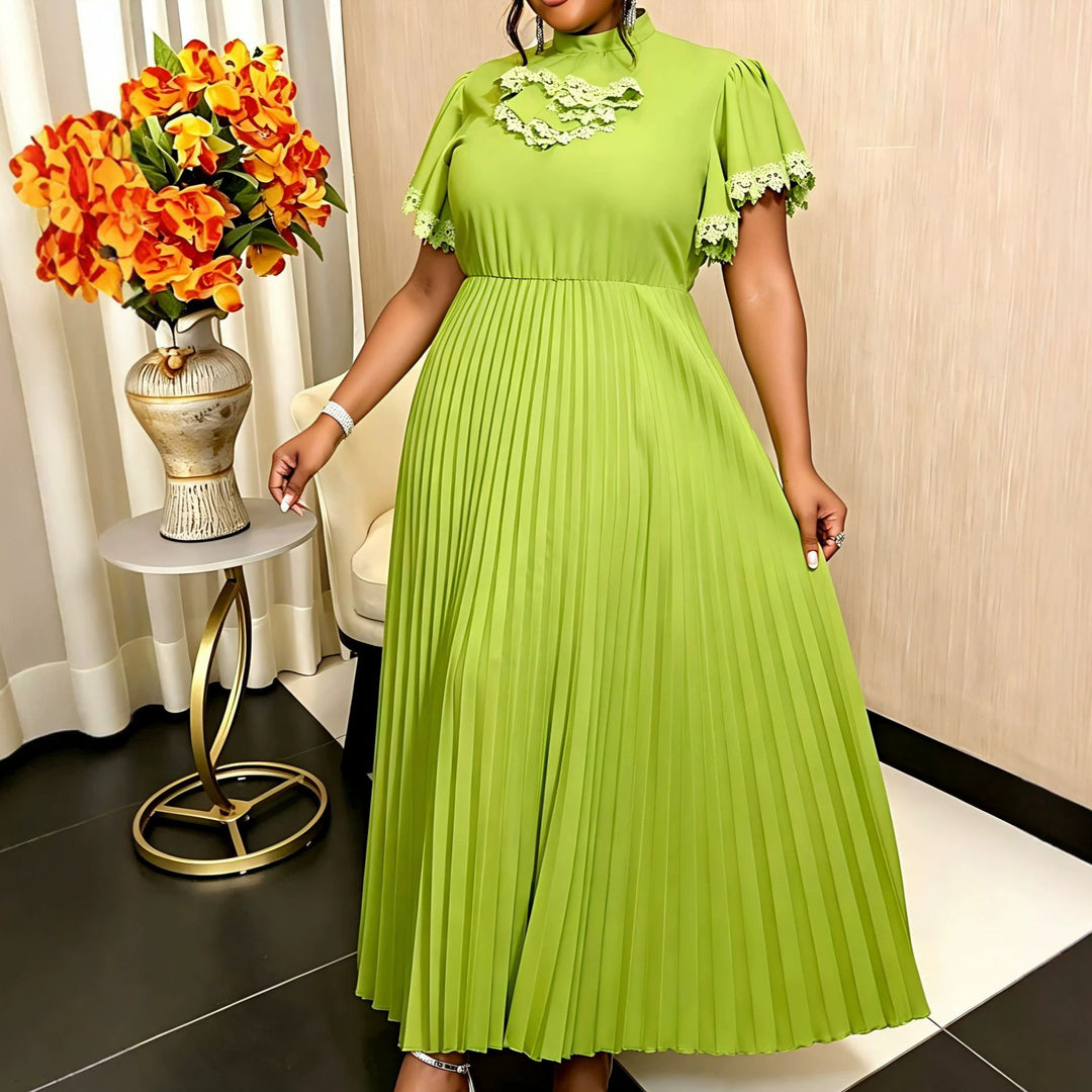 Damer Elegant Maxi-klänning med plisséveck och volangdetaljer Mirla-Eva Jonsson