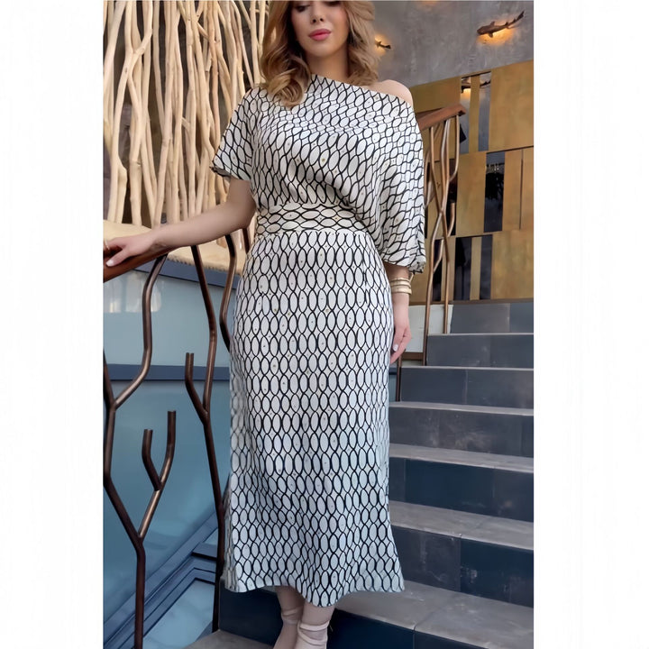 Damer Elegant Maxikjol med asymmetrisk skärning och strukturerat mönster Mirla-Eva Jonsson