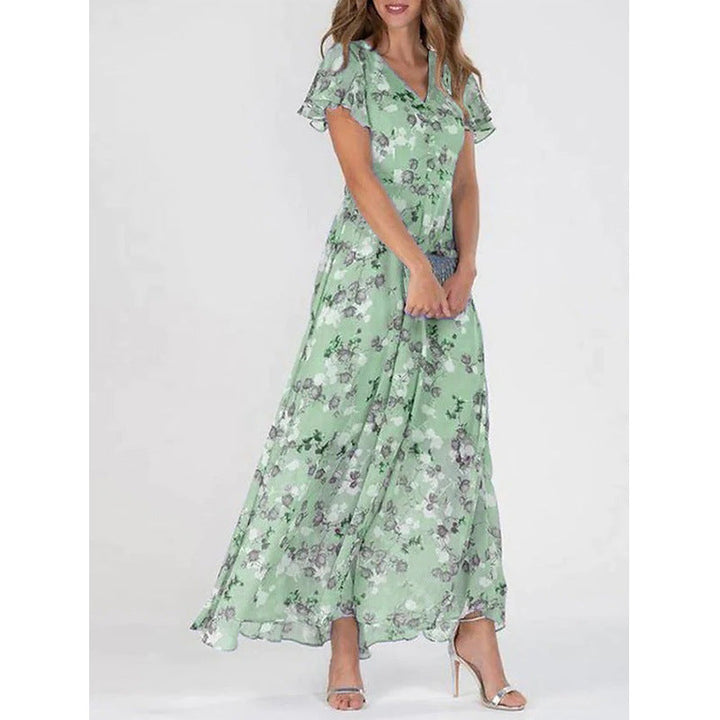 Damer Elegant Maxiklänning med Transparenta Ärmar och Blommönster Mirla-Eva Jonsson