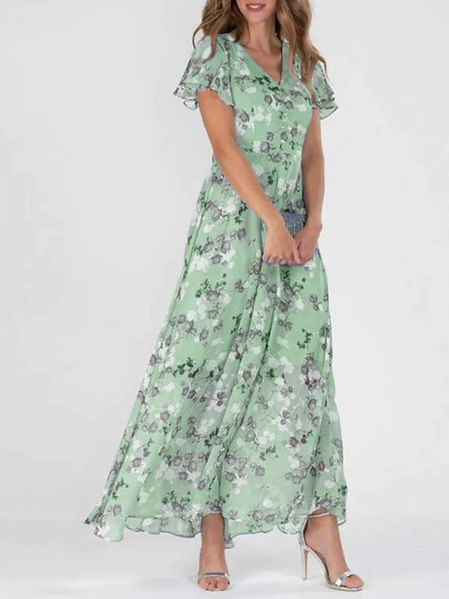 Damer Elegant Maxiklänning med Transparenta Ärmar och Blommönster Mirla-Eva Jonsson