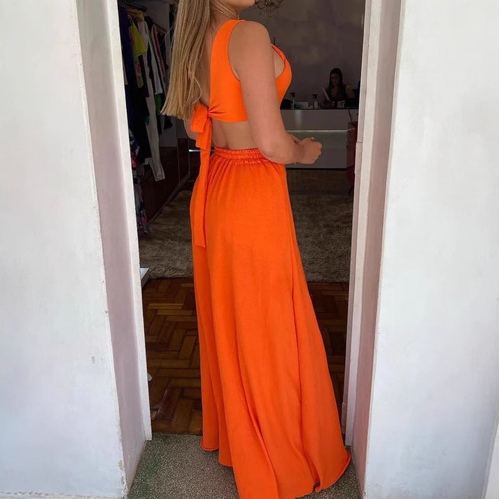 Damer Elegant Maxiklänning med asymmetrisk U-ringning och sidofickor Mirla-Eva Jonsson