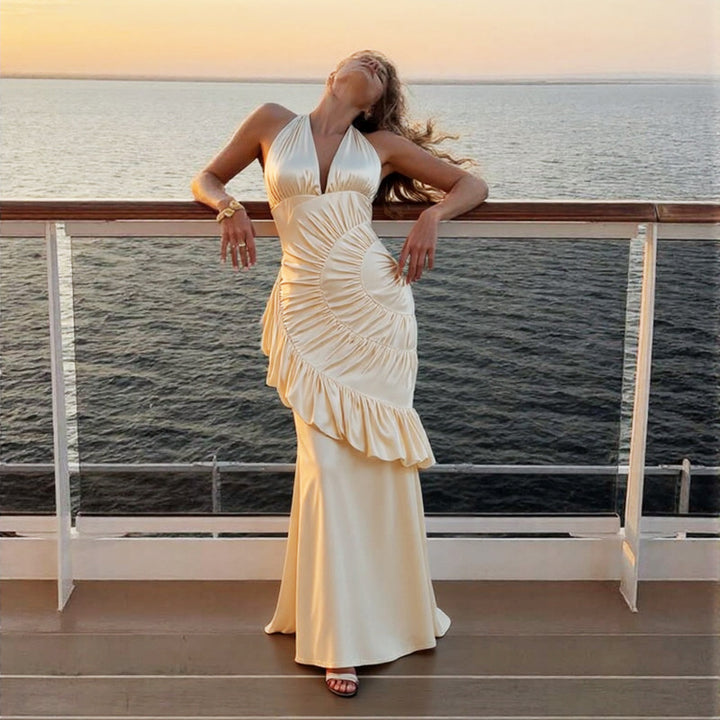 Damer Elegant Maxiklänning med asymmetrisk skärning och raffinerade draperingar Mirla-Eva Jonsson