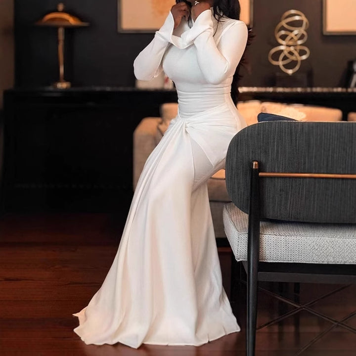 Damer Elegant Maxiklänning med figurnära snitt och volangdetaljer Mirla-Eva Jonsson