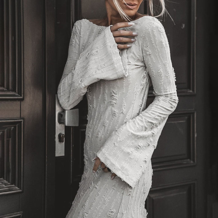 Damer Elegant Maxiklänning med iögonfallande ärmar och strukturerad design Mirla-Eva Jonsson