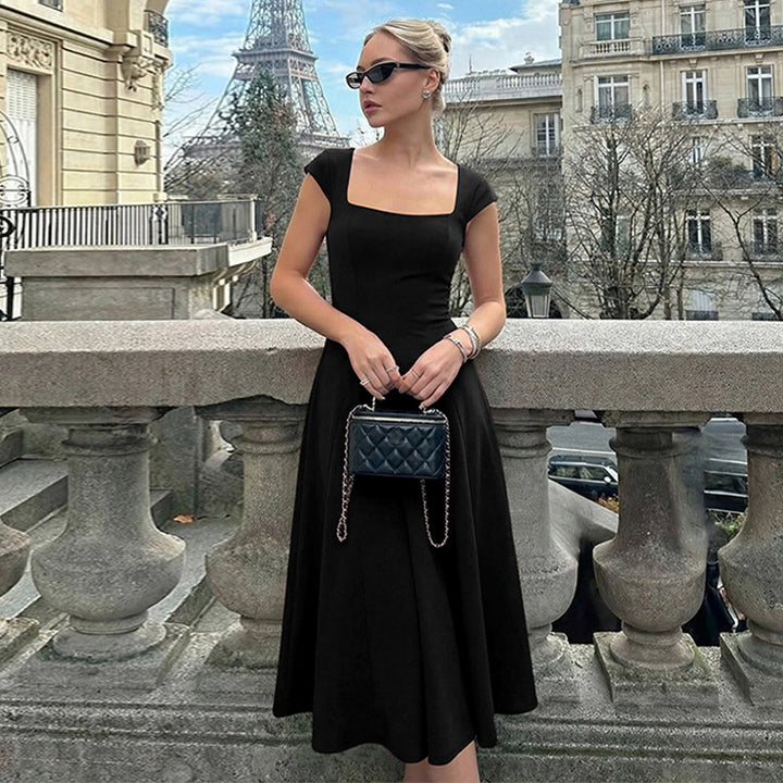 Damer Elegant Maxiklänning med kvadratisk halsringning och flödande kjol Mirla-Eva Jonsson