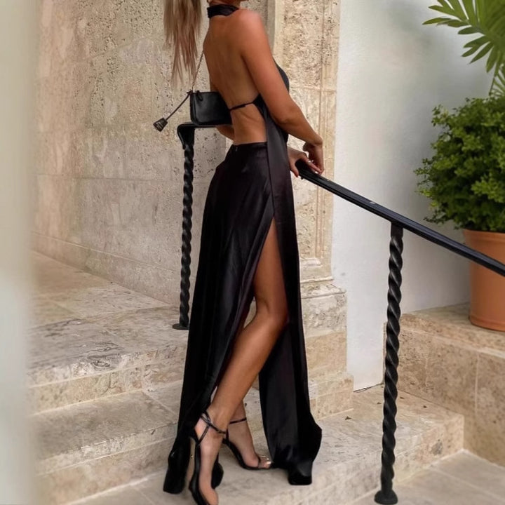 Damer Elegant Maxiklänning med off-shoulder design och djup ryggöppning Mirla-Eva Jonsson