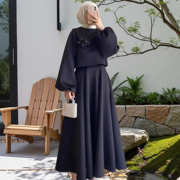 Damer Elegant Maxiklänning med puffärmar och dekorativ blomdetalj Mirla-Eva Jonsson