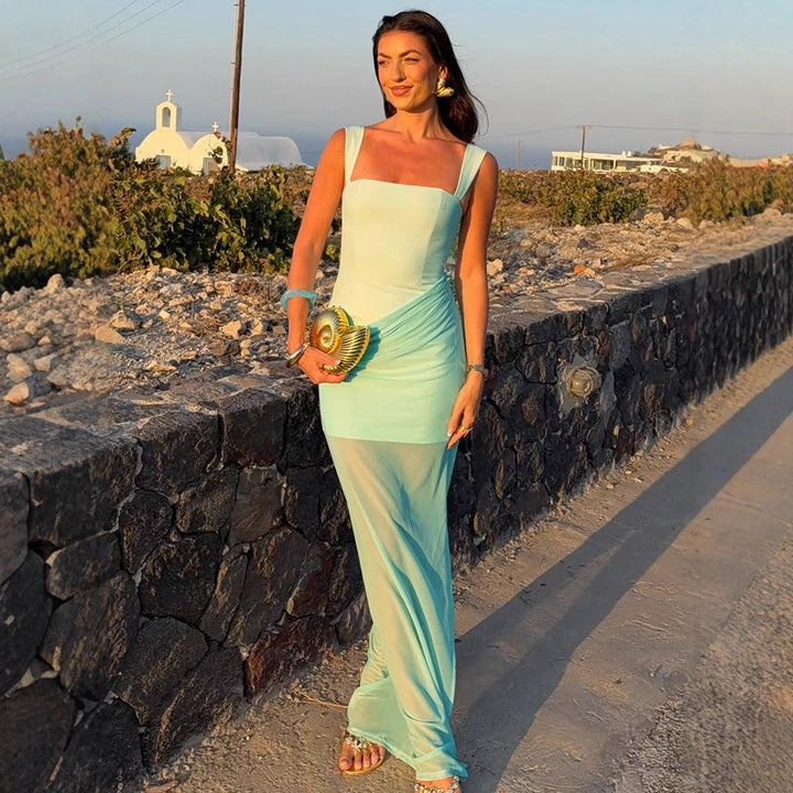 Damer Elegant Maxiklänning med raffinerade draperingar och genomskinlig kjol Mirla-Eva Jonsson