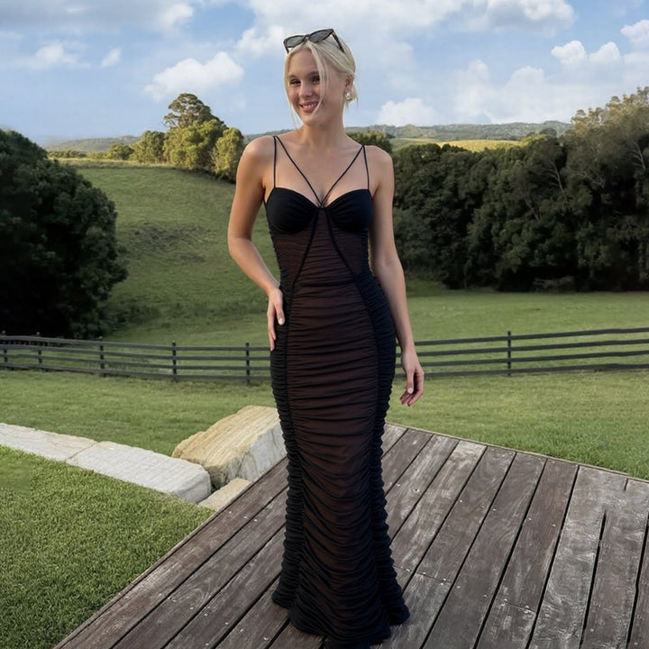 Damer Elegant Maxiklänning med raffinerade volangdetaljer och fina spagettiband Mirla-Eva Jonsson