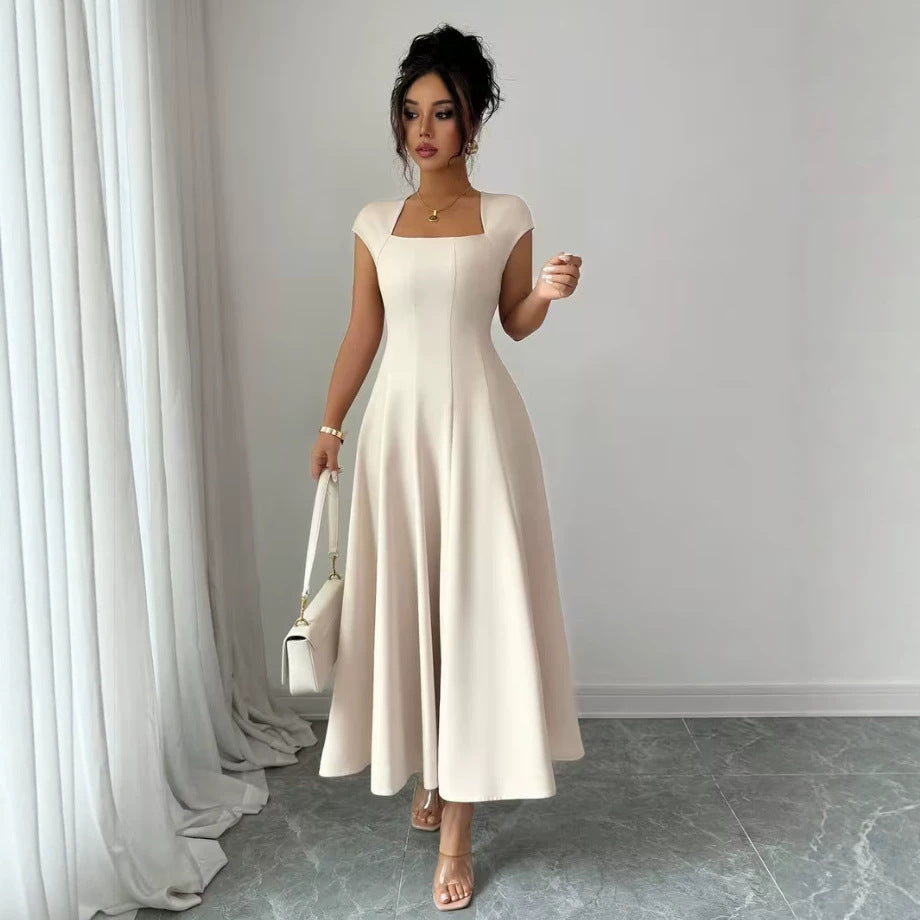 Damer Elegant Maxiklänning med rektangulär halsringning och flödande kjol Mirla-Eva Jonsson
