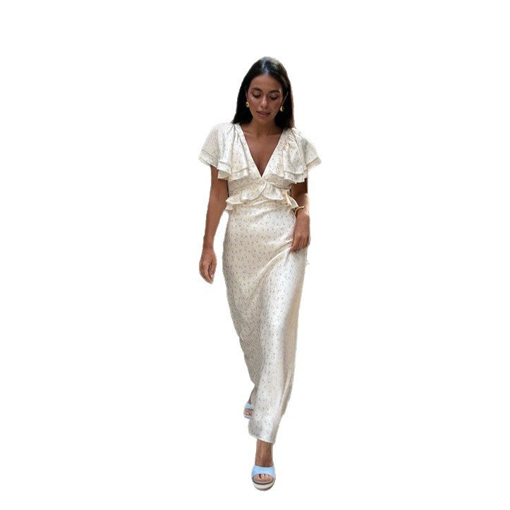 Damer Elegant Maxiklänning med voluminösa volanger och djup V-ringning Mirla-Eva Jonsson
