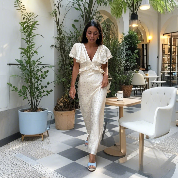 Damer Elegant Maxiklänning med voluminösa volanger och djup V-ringning Mirla-Eva Jonsson