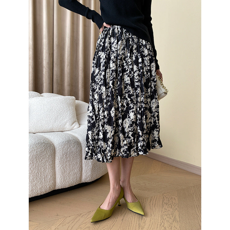 Damer Elegant Midi Kjol med Blommig Tryck och Luftig Silhuett Mirla-Eva Jonsson