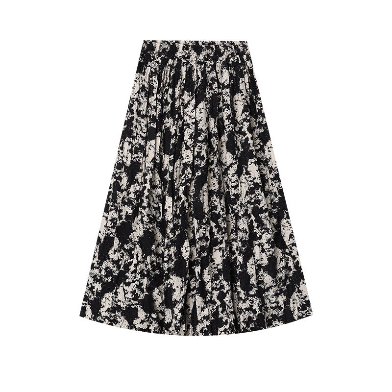 Damer Elegant Midi Kjol med Blommig Tryck och Luftig Silhuett Mirla-Eva Jonsson