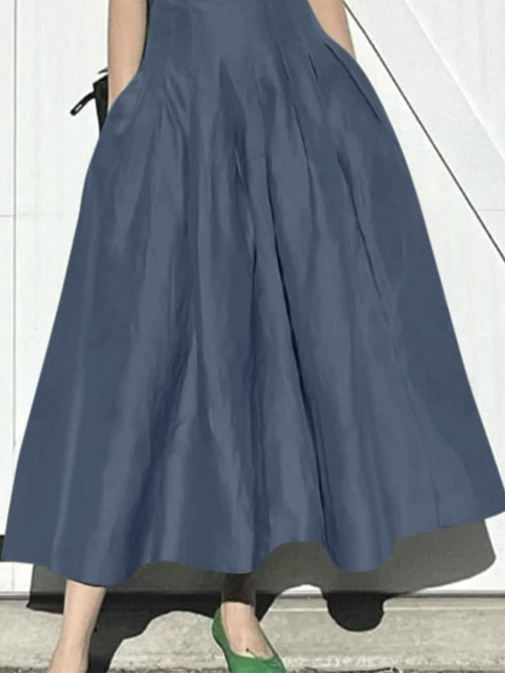 Damer Elegant Midi Kjol med Flödande Snitt och Sida Fickor-Eva Jonsson