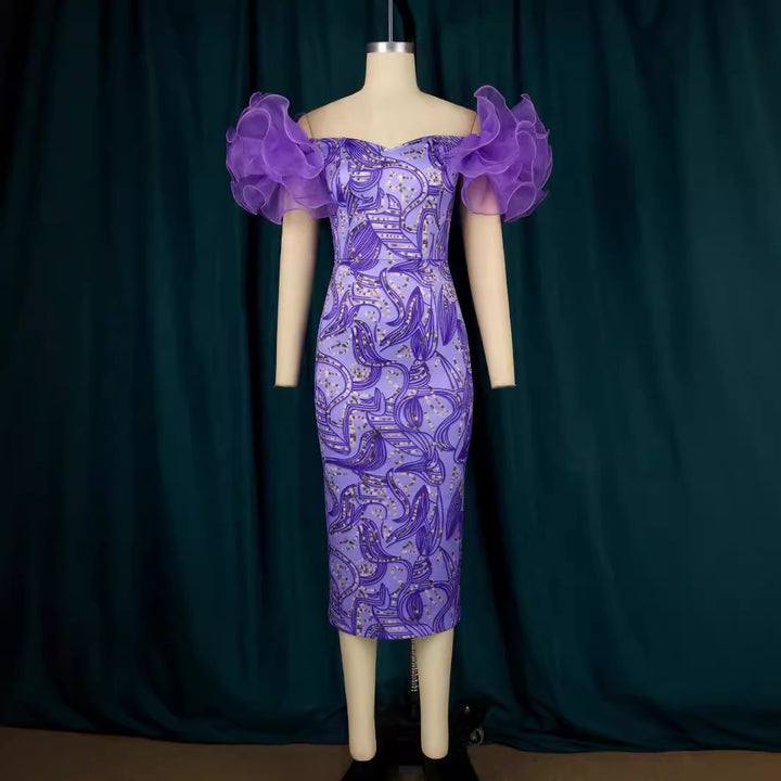Damer Elegant Midi-klänning med innovativa puffärmar och konstnärlig tryck Mirla-Eva Jonsson