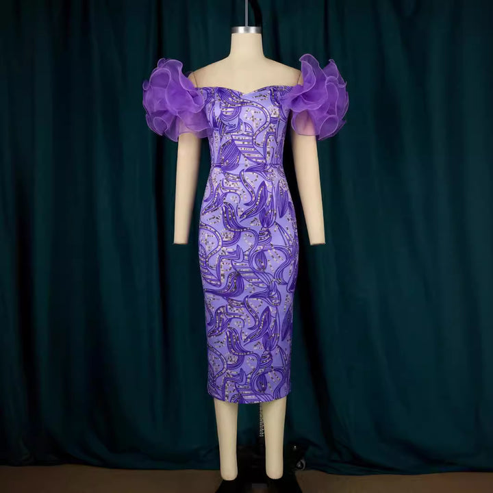 Damer Elegant Midi-klänning med innovativa puffärmar och konstnärlig tryck Mirla-Eva Jonsson