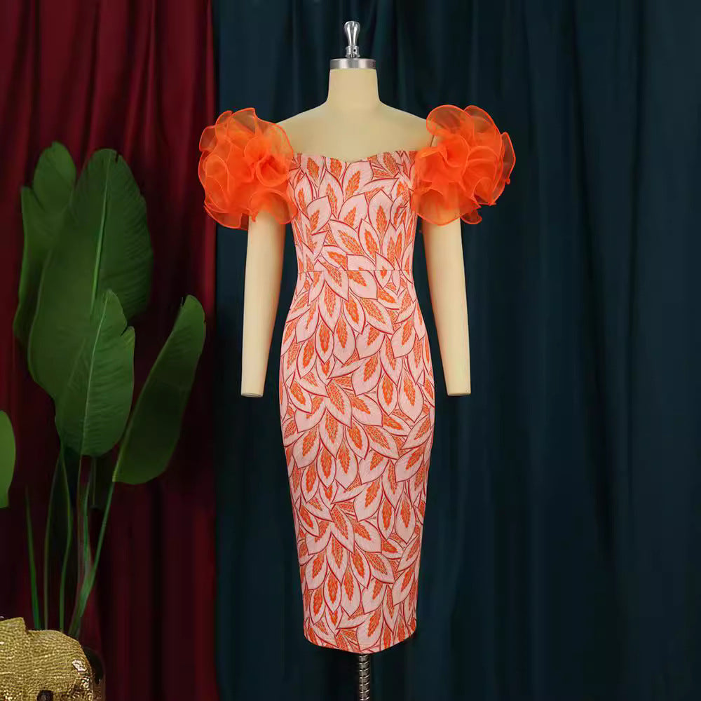 Damer Elegant Midi-klänning med innovativa puffärmar och konstnärlig tryck Mirla-Eva Jonsson