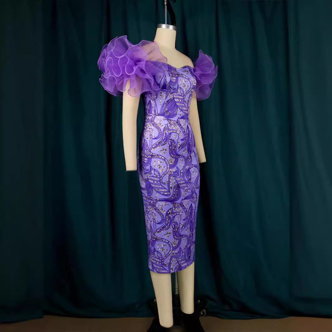 Damer Elegant Midi-klänning med innovativa puffärmar och konstnärlig tryck Mirla-Eva Jonsson