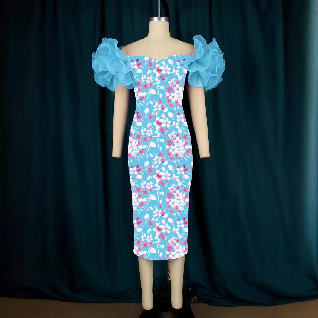 Damer Elegant Midi-klänning med innovativa puffärmar och konstnärlig tryck Mirla-Eva Jonsson