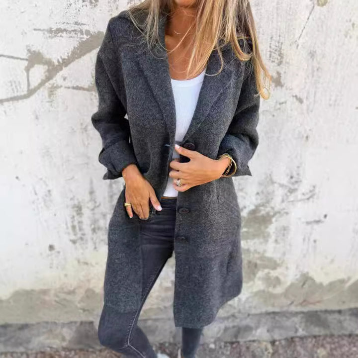 Damer Elegant Oversize-Ullkappa med Genomgående Knappslå och Praktiska Fickor Mirla-Eva Jonsson