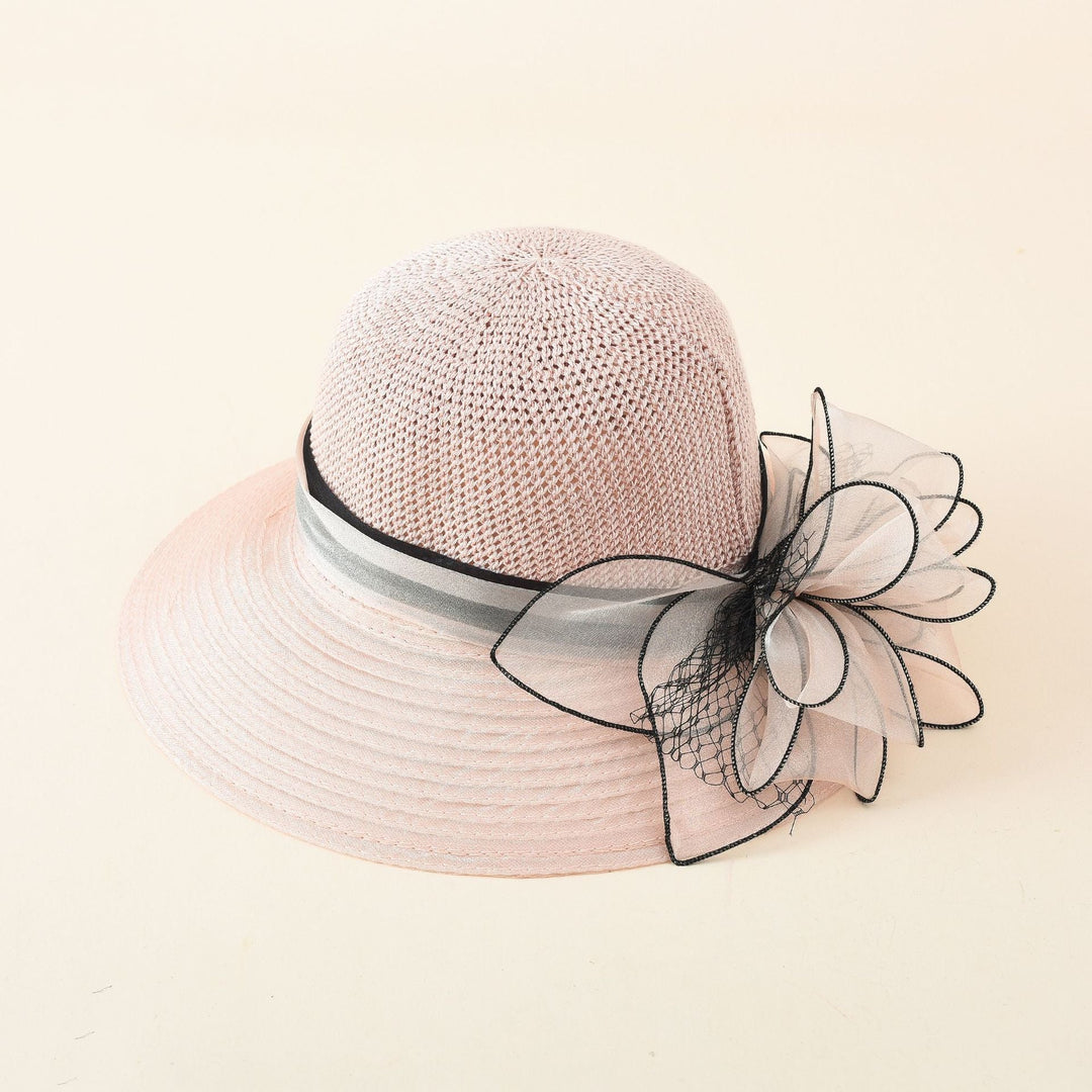 Damer Elegant Solhatt med Fin Slipsdekoration och Bred Brätte Mirla-Eva Jonsson