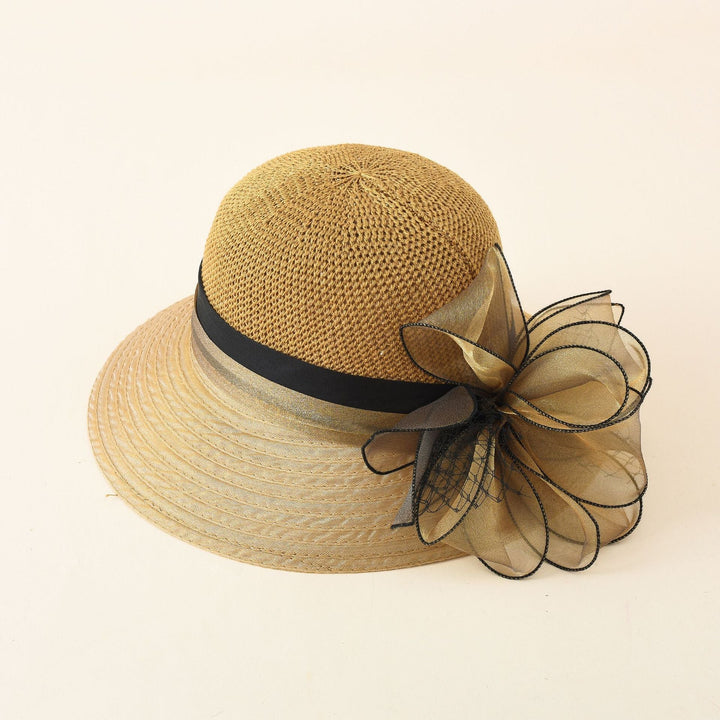 Damer Elegant Solhatt med Fin Slipsdekoration och Bred Brätte Mirla-Eva Jonsson
