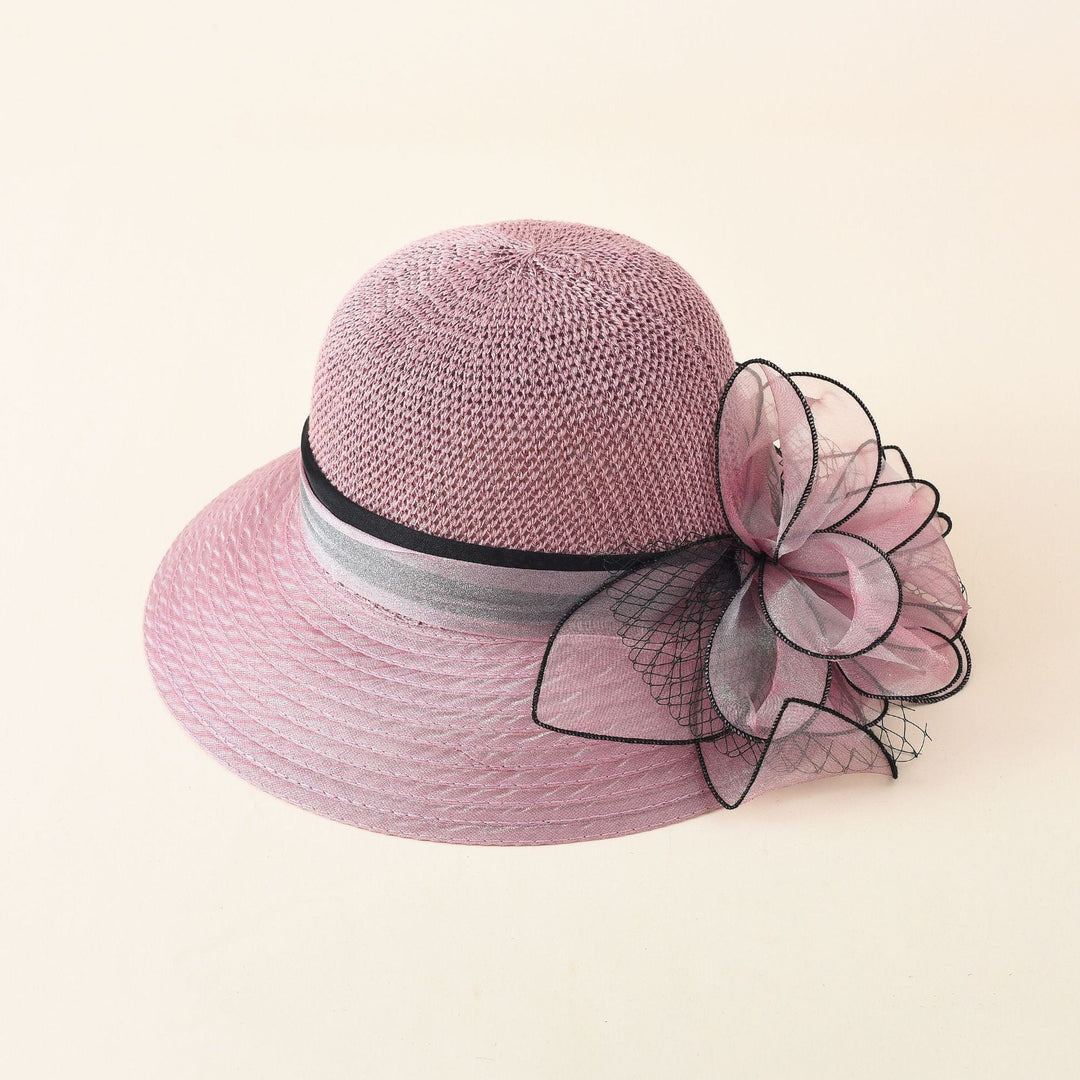 Damer Elegant Solhatt med Fin Slipsdekoration och Bred Brätte Mirla-Eva Jonsson