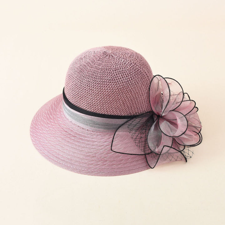 Damer Elegant Solhatt med Fin Slipsdekoration och Bred Brätte Mirla-Eva Jonsson