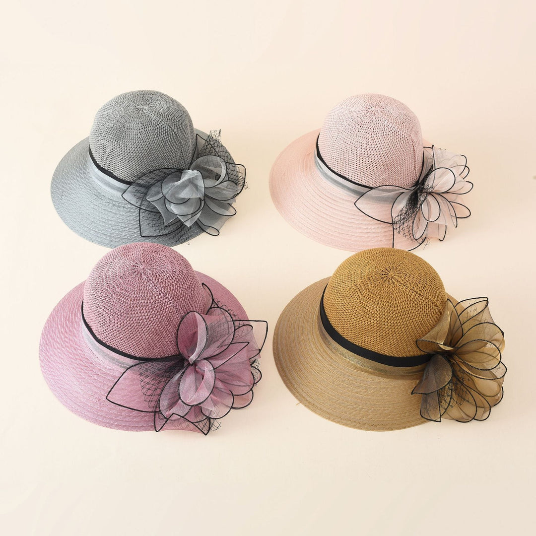 Damer Elegant Solhatt med Fin Slipsdekoration och Bred Brätte Mirla-Eva Jonsson