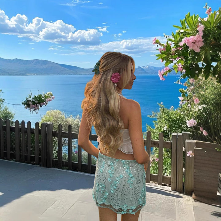 Damer Elegant Strandtopp med flödande fåll och dekorativa detaljer Mirla-Eva Jonsson