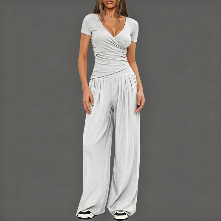 Damer Elegant Wickel- jumpsuit med vida ben och moderna detaljer Mirla-Eva Jonsson