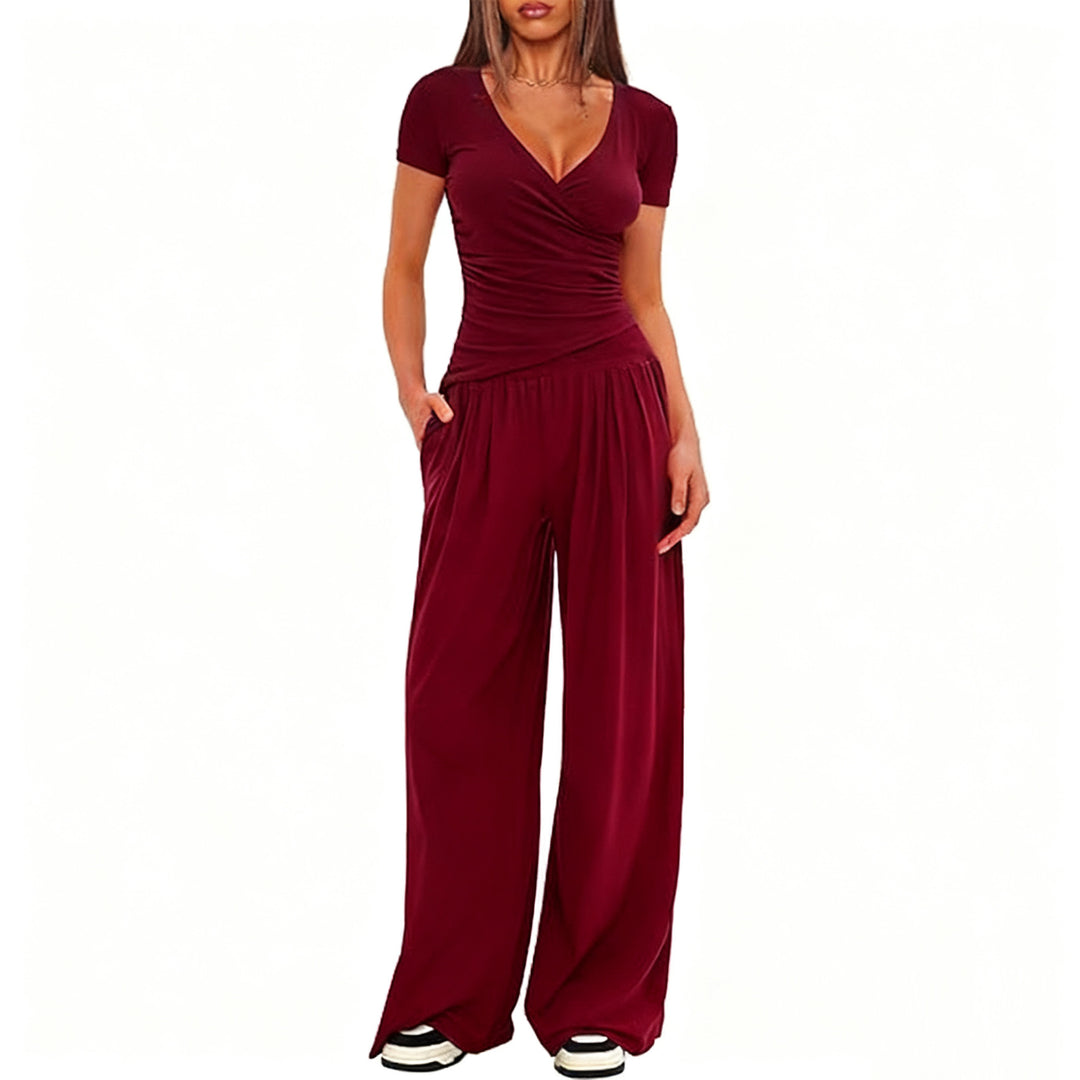 Damer Elegant Wickel- jumpsuit med vida ben och moderna detaljer Mirla-Eva Jonsson