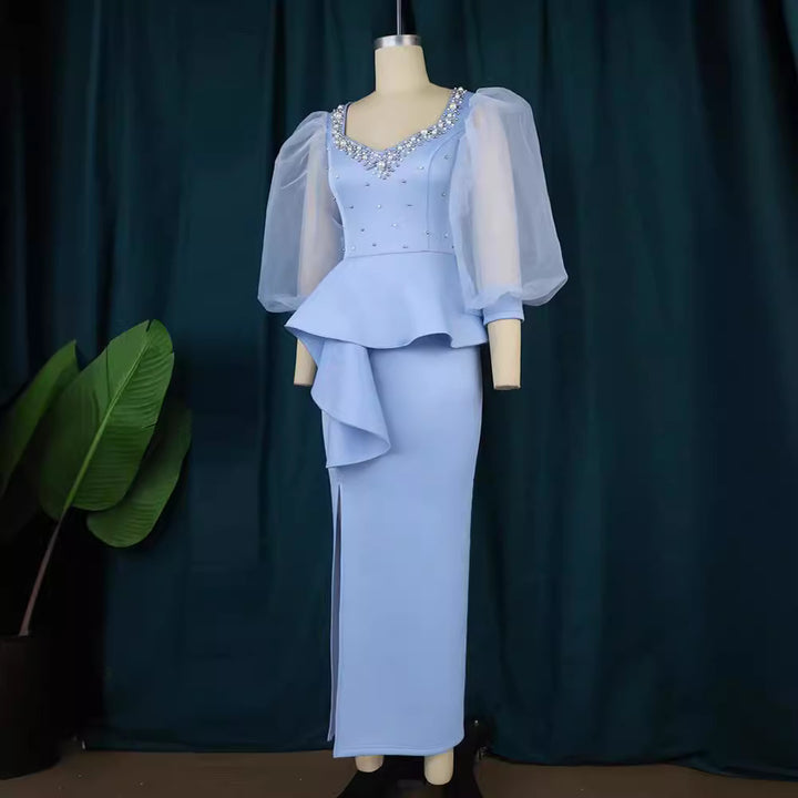 Damer Elegant aftonklänning med glittrande pärlor och voluminösa tylleärmhem Mirla-Eva Jonsson