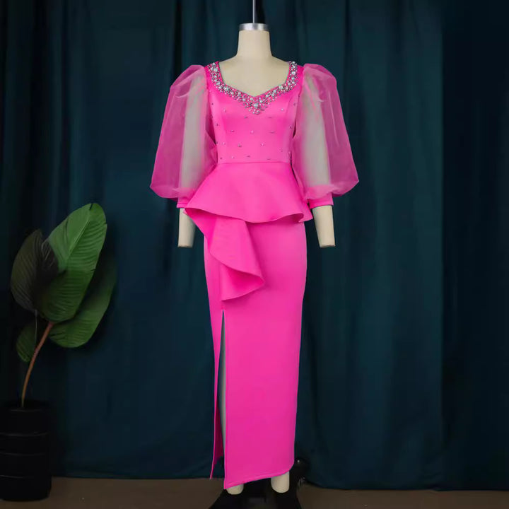Damer Elegant aftonklänning med glittrande pärlor och voluminösa tylleärmhem Mirla-Eva Jonsson
