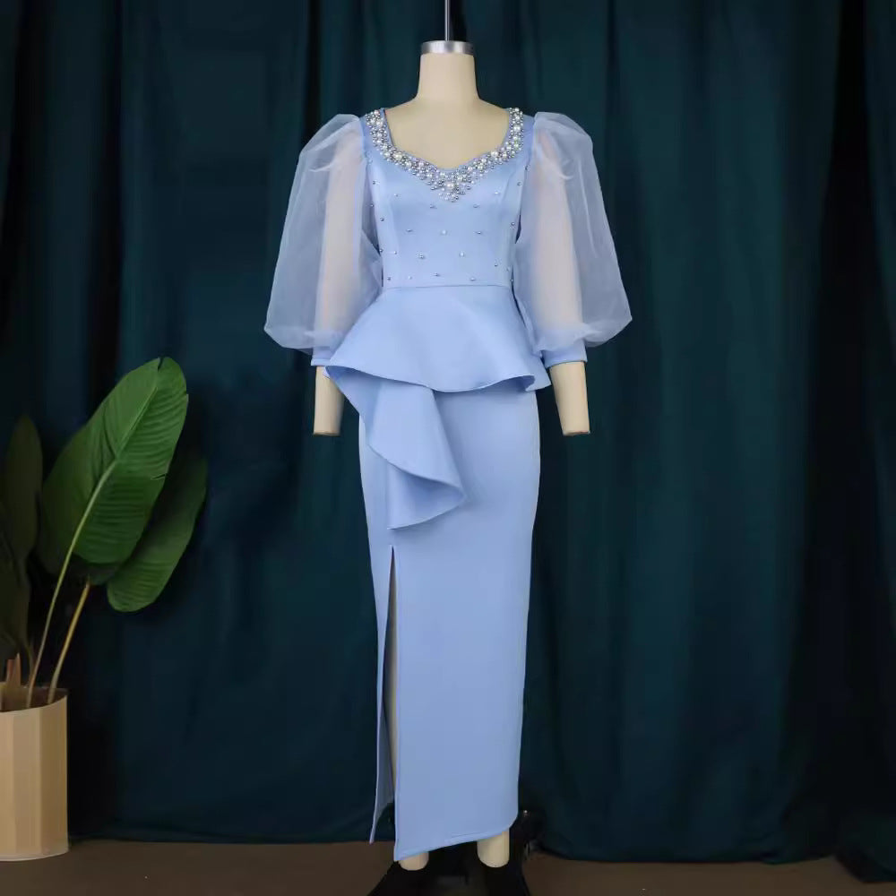 Damer Elegant aftonklänning med glittrande pärlor och voluminösa tylleärmhem Mirla-Eva Jonsson