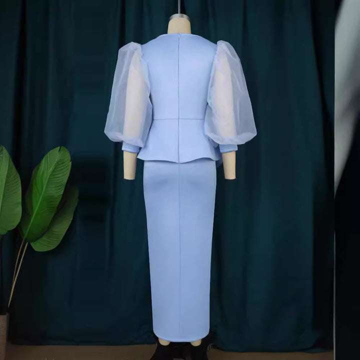 Damer Elegant aftonklänning med glittrande pärlor och voluminösa tylleärmhem Mirla-Eva Jonsson