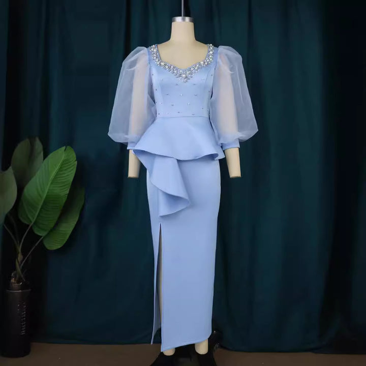 Damer Elegant aftonklänning med glittrande pärlor och voluminösa tylleärmhem Mirla-Eva Jonsson