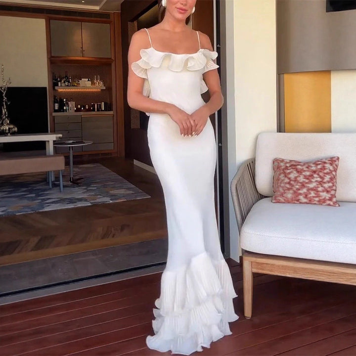 Damer Elegant aftonklänning med volangdetaljer och flytande snitt Mirla-Eva Jonsson