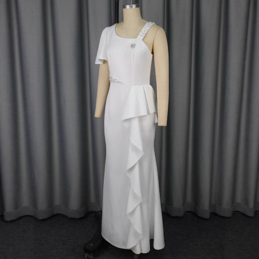 Damer Elegant aftonsklänning med asymmetrisk skärning och volanger Mirla-Eva Jonsson
