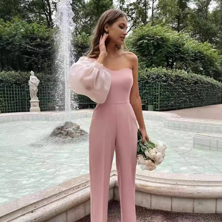 Damer Elegant enhetsdräkt med asymmetrisk skärning och transparenta ärmar Mirla-Eva Jonsson