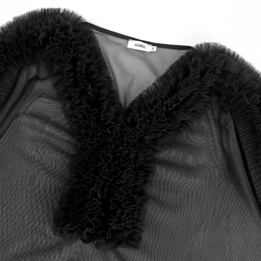 Damer Elegant genomskinlig blus med volangprydda ärmar Mirla-Eva Jonsson
