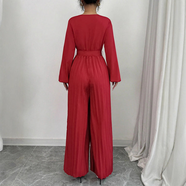 Damer Elegant jumpsuit med midjejusterbart bälte och plisserad skärning Mirla-Eva Jonsson