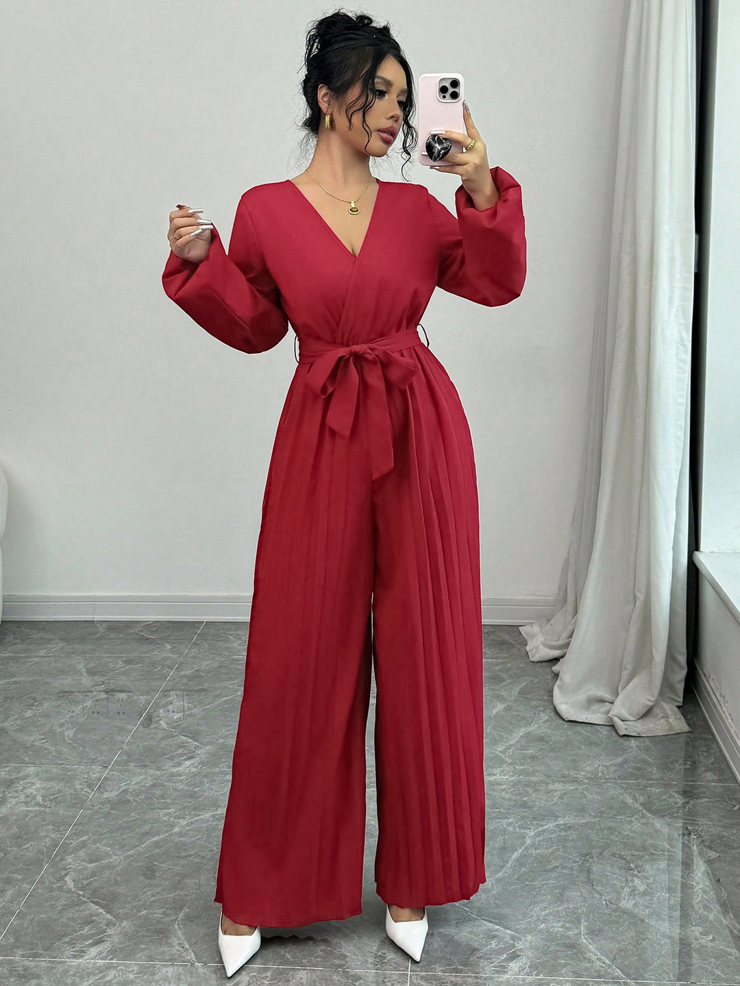 Damer Elegant jumpsuit med midjejusterbart bälte och plisserad skärning Mirla-Eva Jonsson