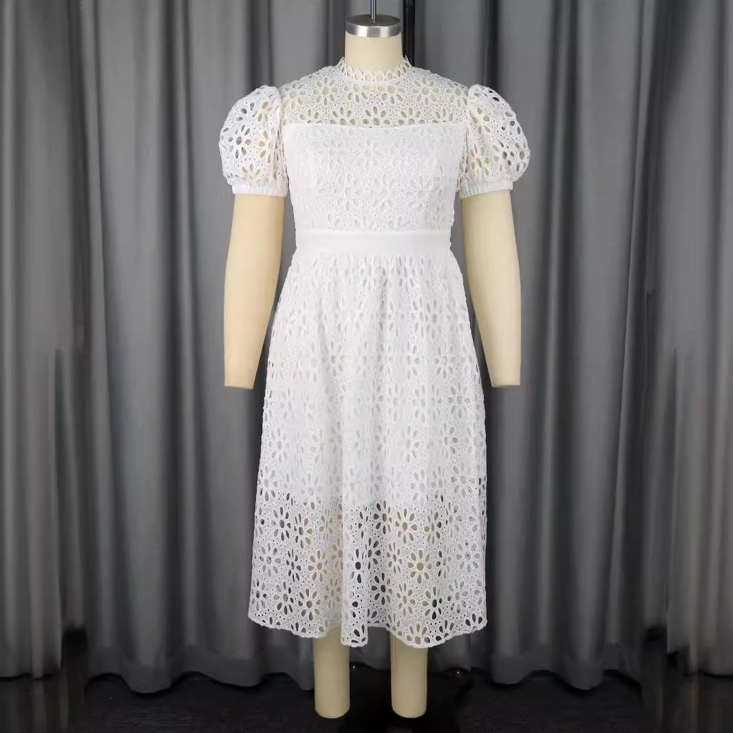 Damer Elegant klänning med blommönster och puffärmar Mirla-Eva Jonsson