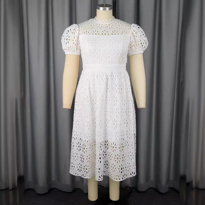 Damer Elegant klänning med blommönster och puffärmar Mirla-Eva Jonsson