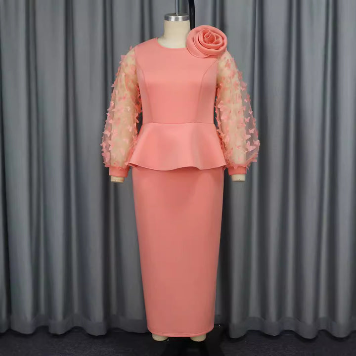 Damer Elegant klänning med extravaganta puffärmar och blommig detalj Mirla-Eva Jonsson