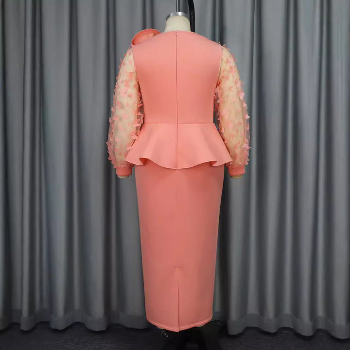 Damer Elegant klänning med extravaganta puffärmar och blommig detalj Mirla-Eva Jonsson
