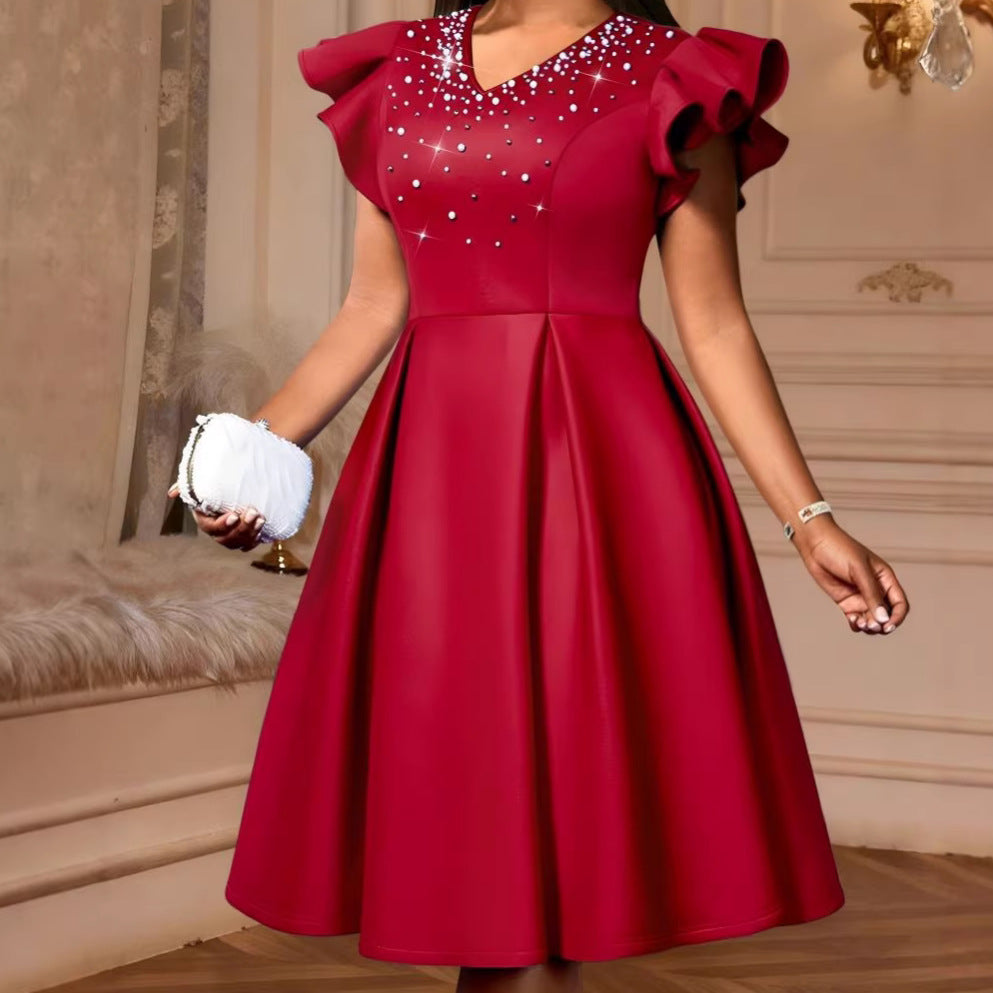 Damer Elegant klänning med glittrande strassbeslag och voluminösa ärmar Mirla-Eva Jonsson